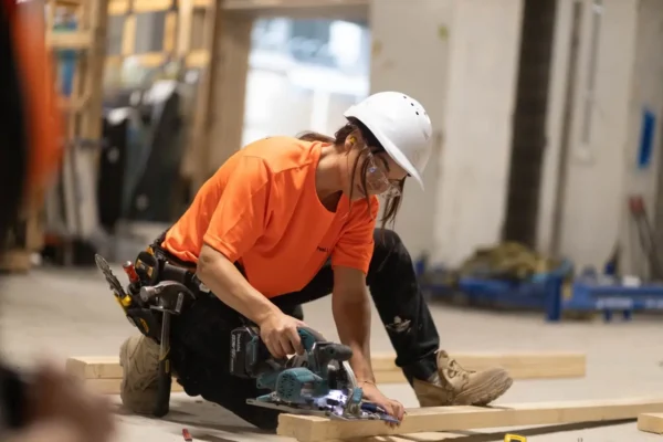 Carpenter on a commercial site cutting timber | Fast Labour Hire professional carpenter cutting timber on site